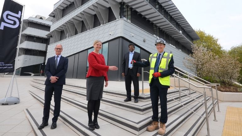 University of Leicester representatives receive the keys for Phase 1 of the Space Park Leicester development.