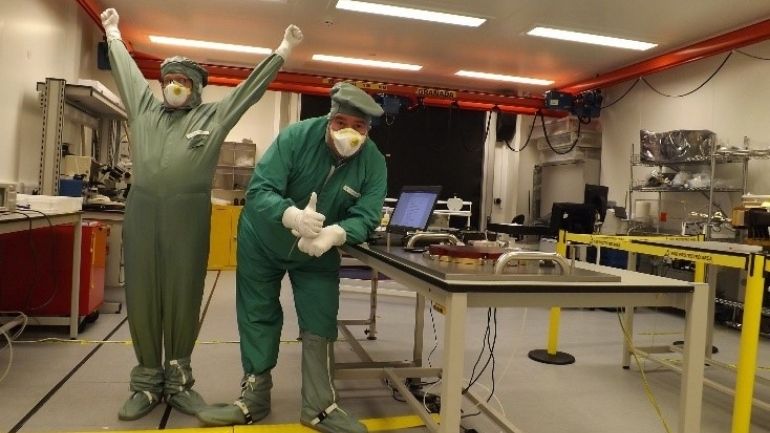 Two Leicester scientists celebrate the completion of the lobster eye mirror for the SVOM satellite observatory.