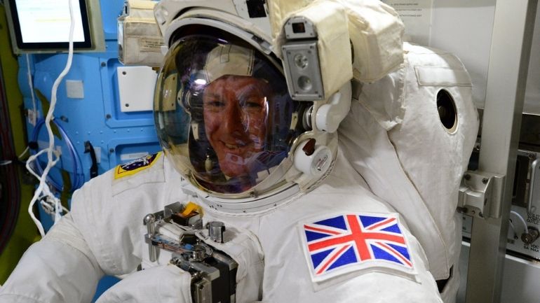 Tim Peake in spacesuit with UK patch on the International Space Station.