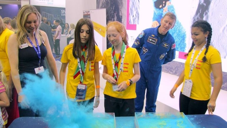 Tim Peake with Dr Suzie Imber and three schoolchildren at the National Space Centre in Leicester.