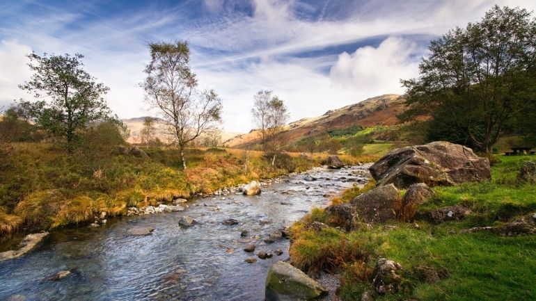 A river running through the Lake District countryside.