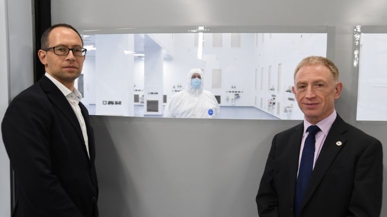 Professor Richard Ambrosi, Professor of Space Instrumentation and Space Nuclear Power Systems with Vaughan Shayler, Operations Manager, in front of Space Park Leicester's new clean room facility.