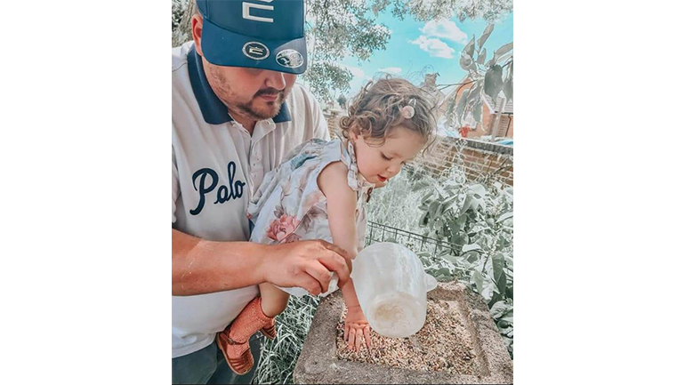John Bryan enjoying time in the garden with daughter Dolly.