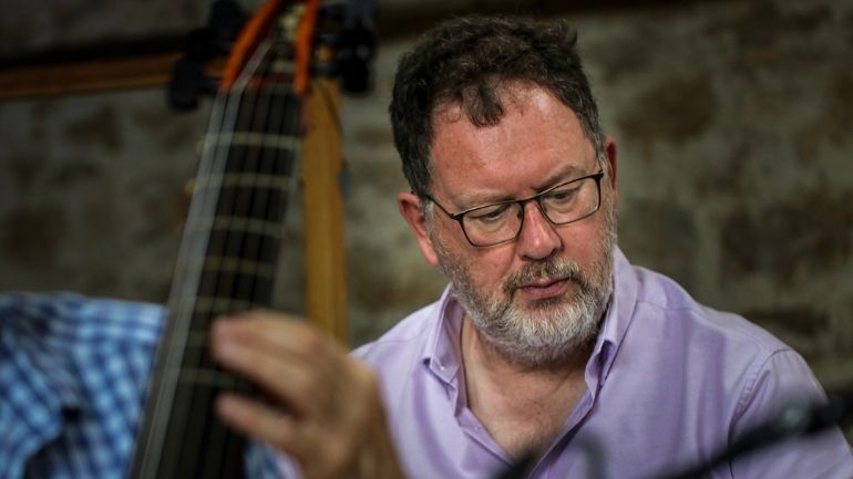 Andrew Hugill performing a musical composition.