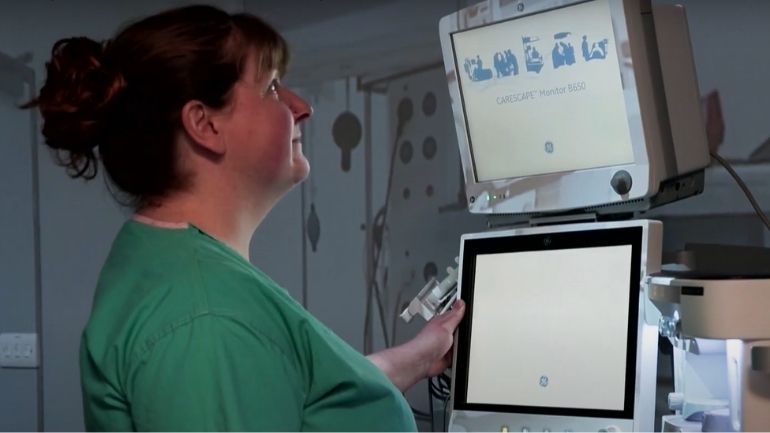 Vicky Hain monitoring a medical screen.
