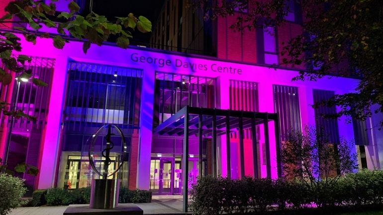 George Davies Centre lit in pink and blue light to mark Baby Loss Awareness Week.