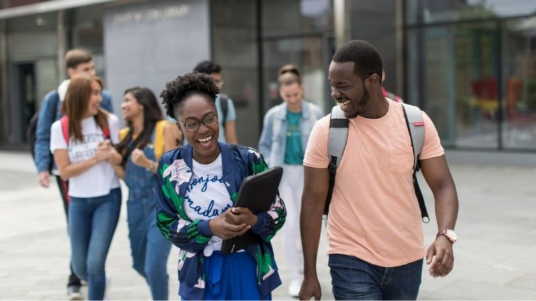 A group of students in front of the David Wilson Library.