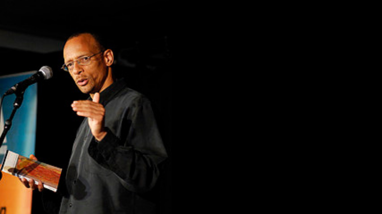 Fred D'Aguiar delivering a piece of his poetry.