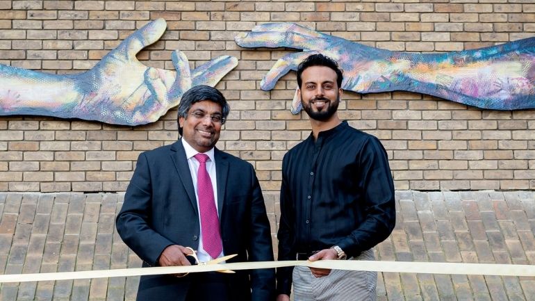 Professor Nishan Canagarajah, Vice-Chancellor and President at the University of Leicester, with artist Vishal Joshi at the unveiling of Hands of Freedom.