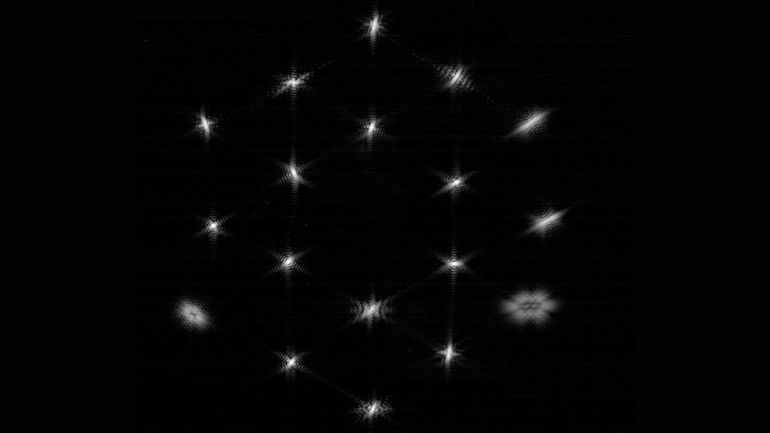 Dots of starlight arranged in a pattern similar to the honeycomb shape of the James Webb Space Telescope's primary mirror.