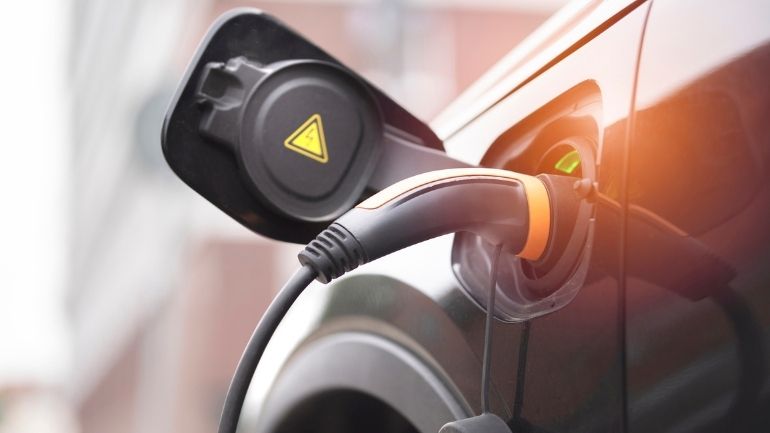 A plug-in electric vehicle (EV) being charged.