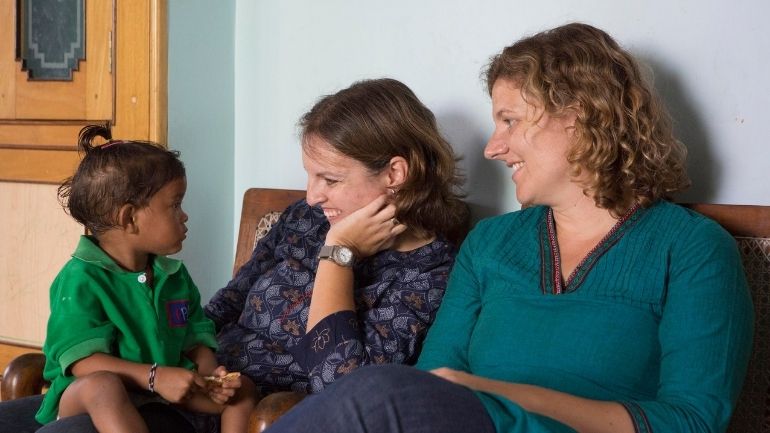Dr Mary Cusack and Dr Cat Morris with an Indian child.