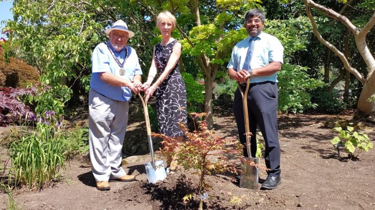 Professor Nishan Canagarajah plants a tree at the University of Leicester Botanic Garden alongside Councillor Jeffrey Kaufman and CEO of Oadby and Wigston Borough Council, Anne Court.