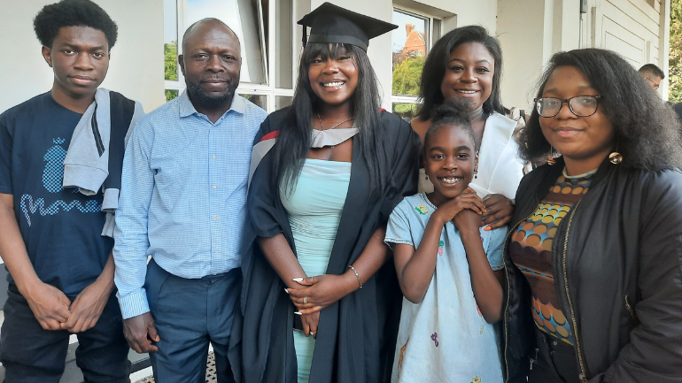 Gloria on her graduation day with her family