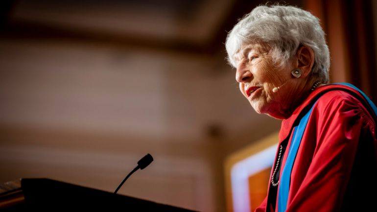 Margaret Kivelson speaks at the lectern as she accepts her honorary doctorate.
