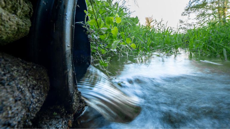 Water running from water treatment works into filtration ponds before the water reaches a river in Norfolk, UK.