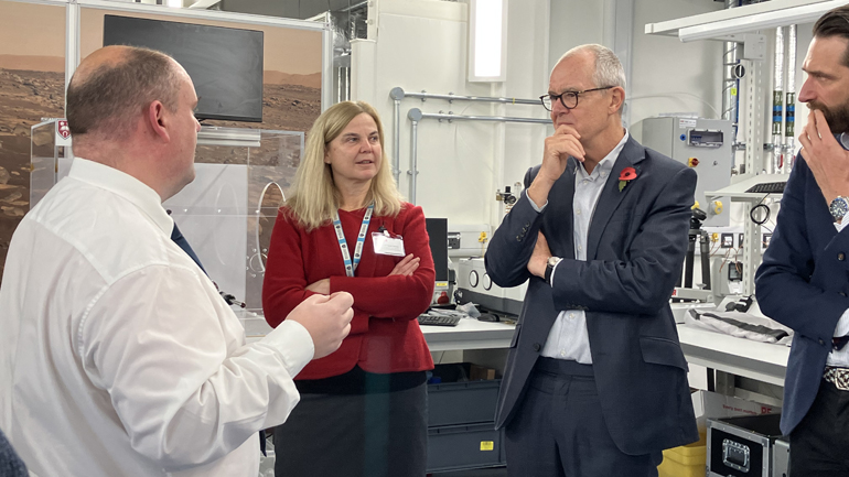 Sir Patrick Vallance meets with members of staff.