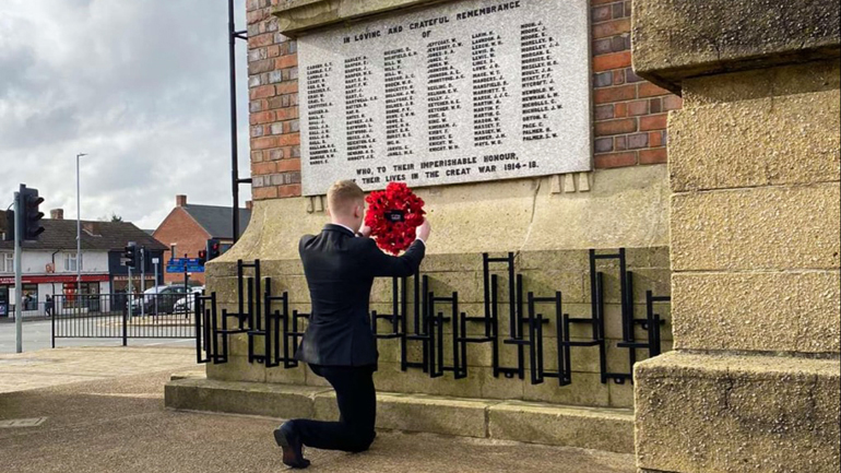 The first wreath to be laid for the Poppy Pilgrimage in 2022 is placed at Coalville Memorial Clock Tower.