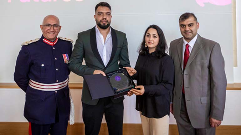 Staff from Bright Path Futures accept award from Lord-Lieutenant of Leicestershire, Mike Kapur (Credit: RedPix)