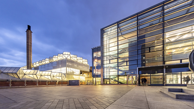 The Engineering Building and David Wilson Library at night.