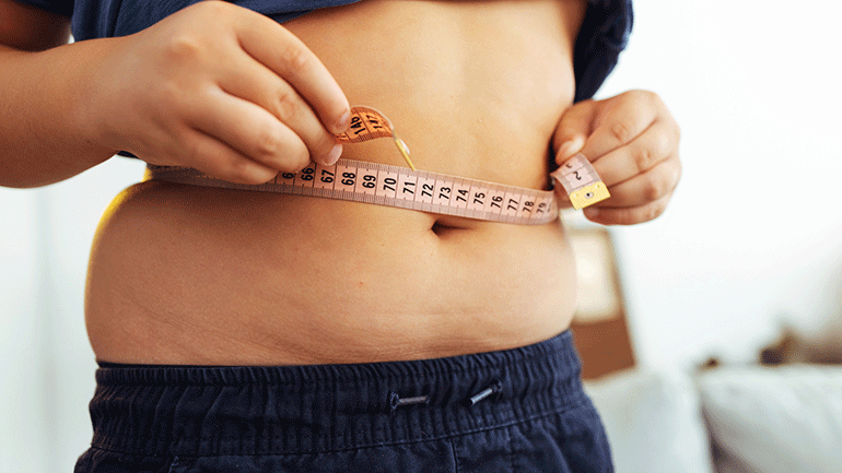 Man measuring his waist