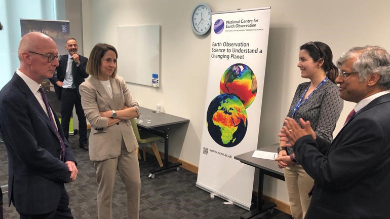 L-R: Pat McFadden MP and Liz Kendall MP speak to Dr Cristina Ruiz Villena and Dr John Remedios from the National Centre for Earth Observation.