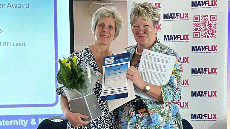 Dr Helen McIntyre, Associate Professor in Midwifery (left) receives her award from Sue MacDonald, Midwife Consultant and Educationalist 
