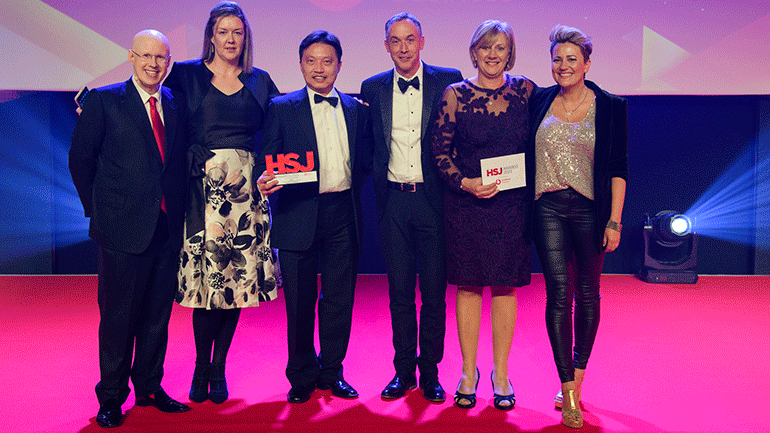 The team receiving their award alongside guest host Matt Lucas (far left)