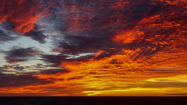 An electrifying sunset lights up the sky over the southern end of the Big Island on Sept. 7th, 2023. Credit: M. Parker, ECORD/IODP