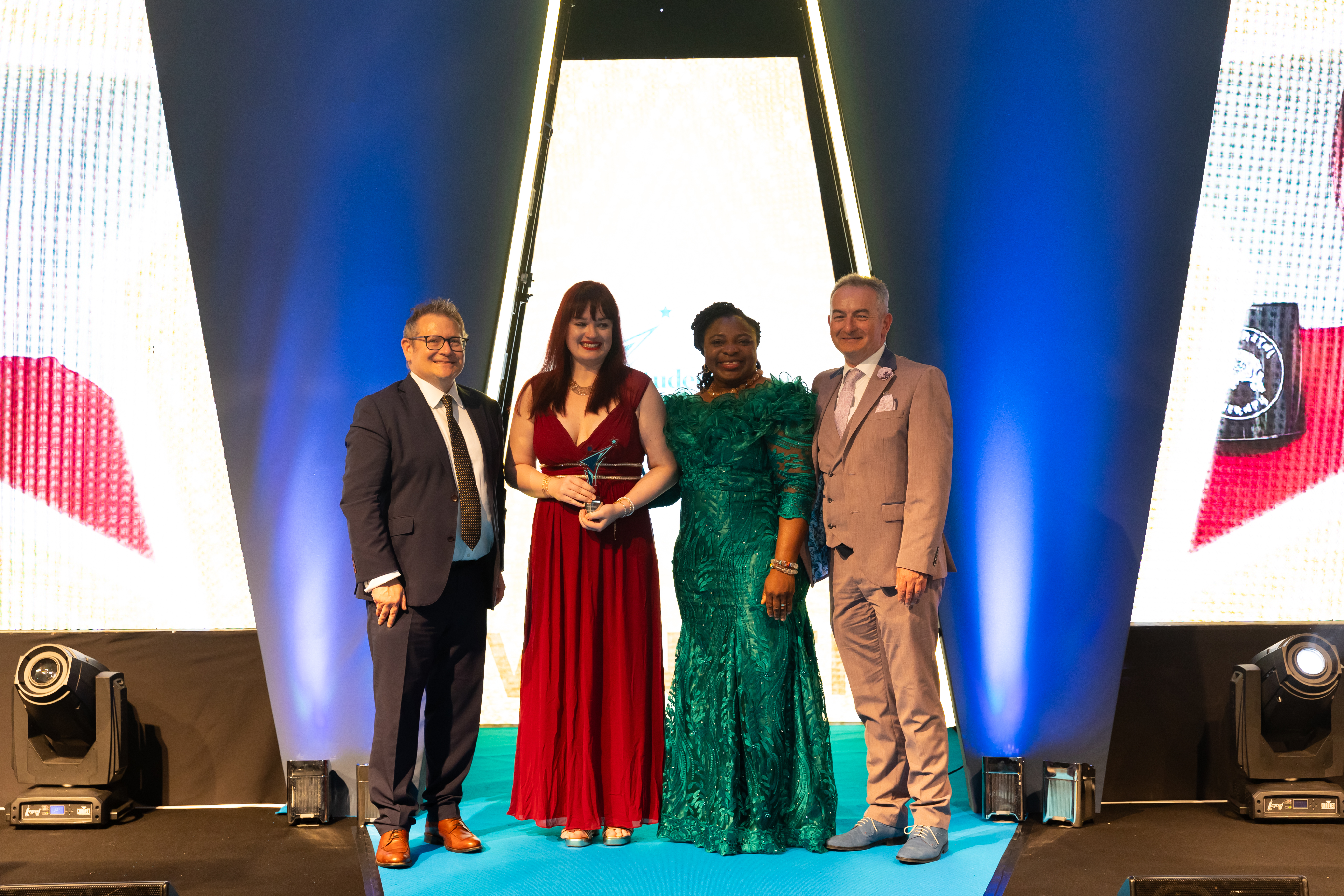 Amber Fletcher (second left) picks up her award. Star media photo