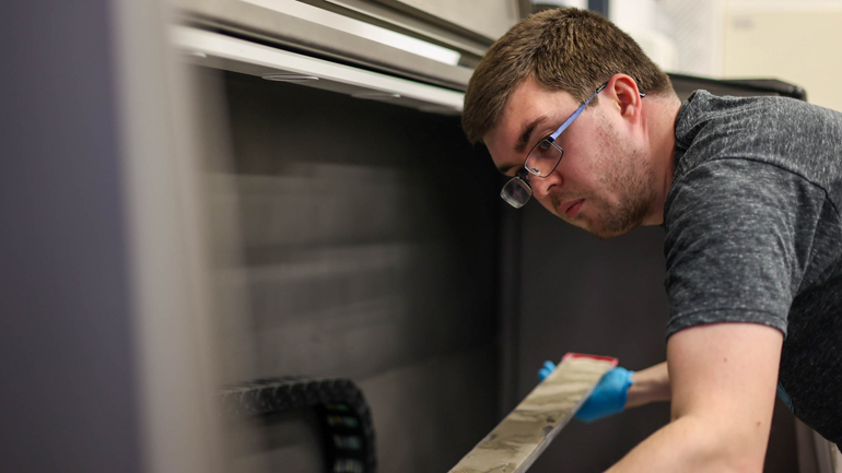 Andrew McIntyre (University of Leicester) loading a core into the high-resolution core imager. Credit: parker@ECORD_IODP