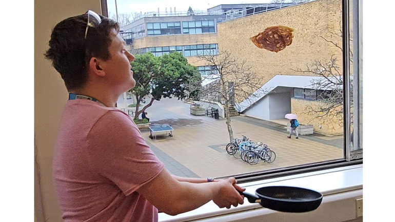 Josh Smalley flips a pancake,