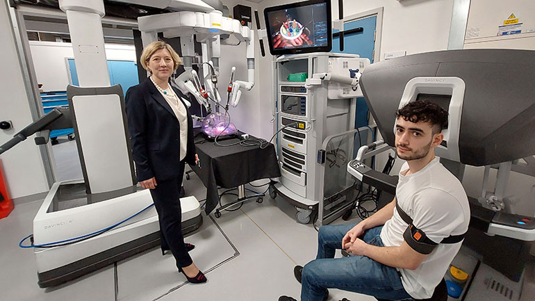 Dr Esther Moss and Medical student Daniel Peck with the Da Vinci Xi 
