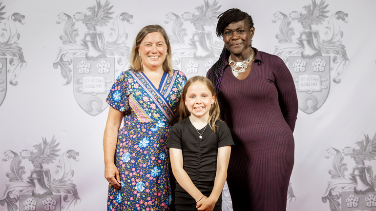 Sara Green stands next to Dame Maggie Aderin-Pocock. Phillipa Hird stands in front of them. 