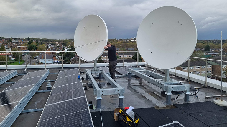 The satellite dishes being installed on the Space Park Leicester roof.
