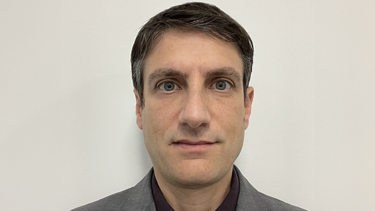 Carlo Panara stood against a white background
