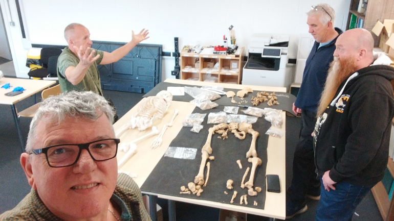 Aidan Phillips with skeleton bones