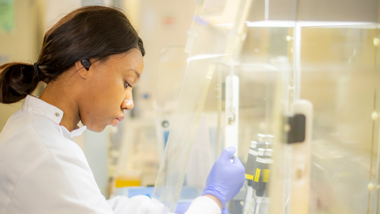 A postgraduate researcher conducting an experiment.