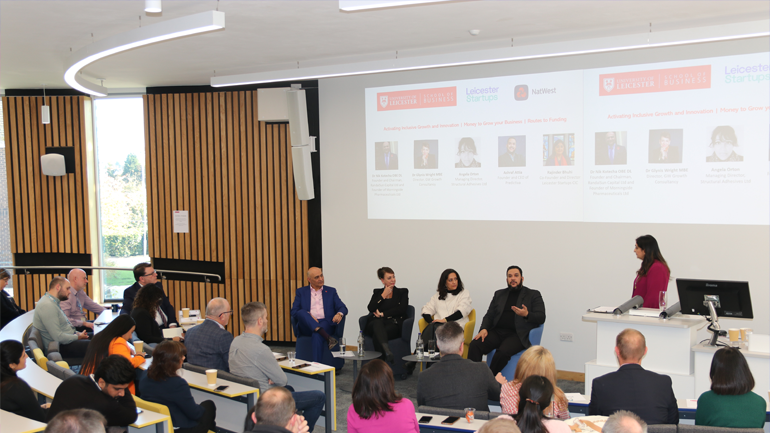 Audience watches a talk in a lecture theatre at Leicester Business Festival