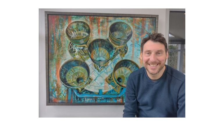 Space artist Matt Turner with one of his works.