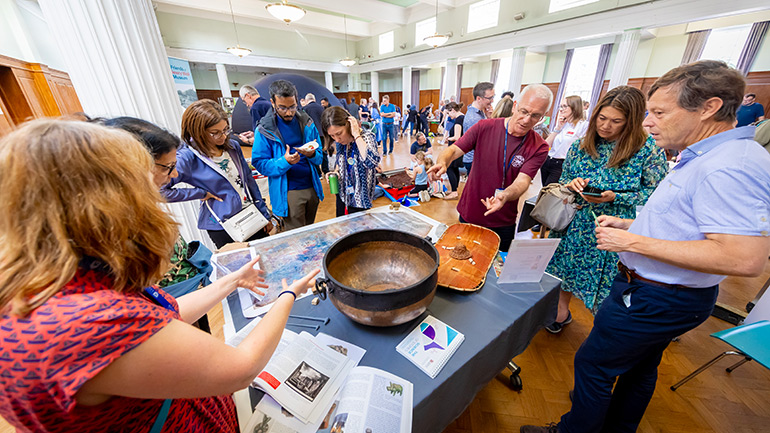 Visitors speak with University of Leicester archaeologists.