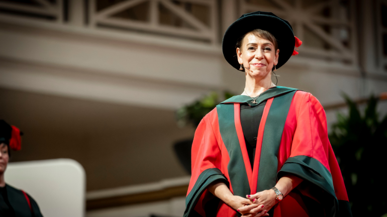 Glynis Wright in graduation robes and hat