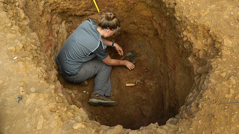 The Burrough Hill hoard is revealed during careful excavation at the base of a deep storage pit, © ULAS