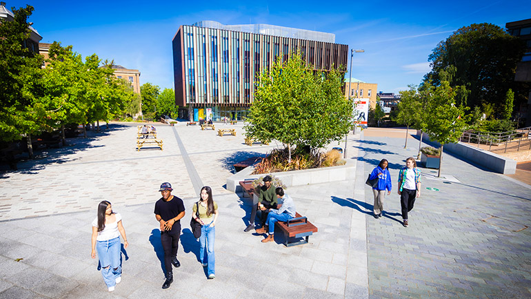 Students walking in Centenary Square, in front of the Students' Union.
