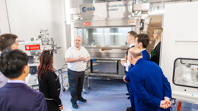 Visitors view the Double Walled Isolator.