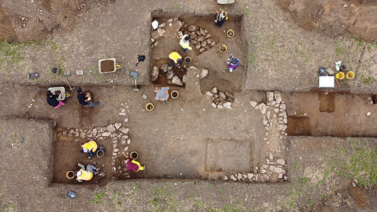University of Leicester students hard at work excavating a room within the villa complex.