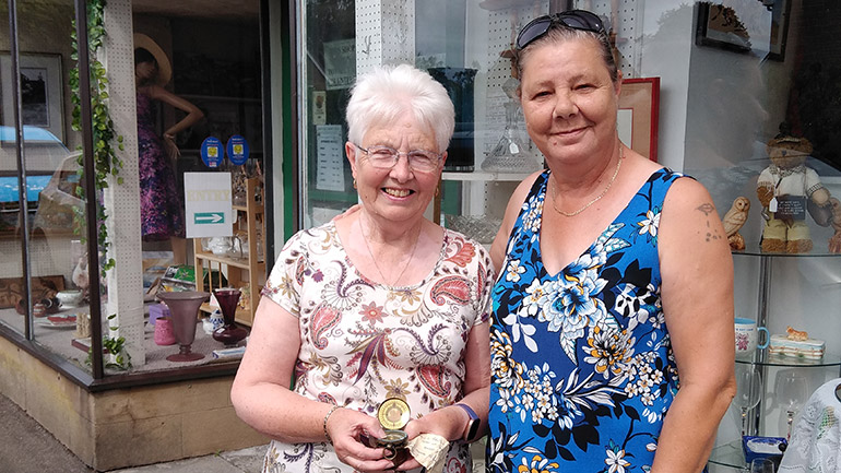 Val Ford with a fellow charity shop volunteer.