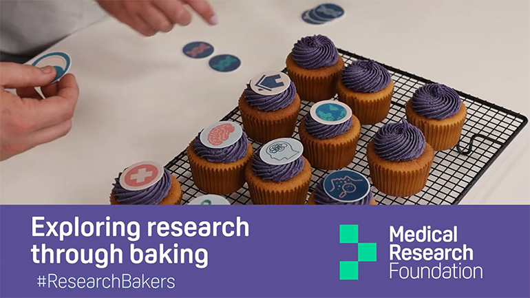 Still image from a video of Josh Smalley baking with Bristol Biomedical Research Centre researcher Lavinia Paternoster.