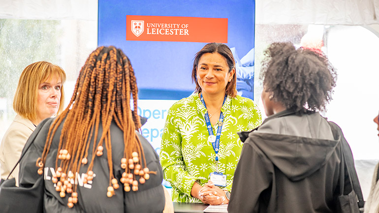 University of Leicester staff speaking to visitors.