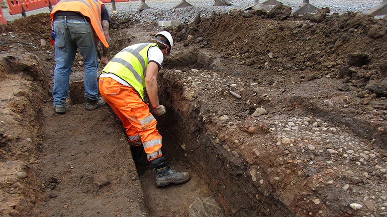Leicester Market medieval cobble surfaces with Roman features below. Credit - ULAS